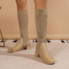 Newness Cosmopolitan Knit Boots in a stylish casual setting The image shows the knit texture and comfortable design