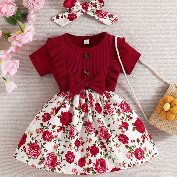 Adorable baby girl wearing a Summer Bloom floral dress, perfect for summer.