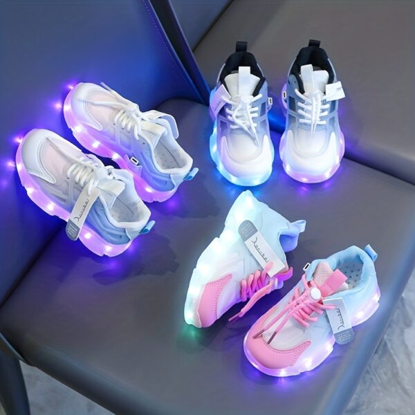Kids' GUANGLAN Nova Glow Shoes lighting up at night, showcasing their lightweight and durable design. Perfect for nighttime play and adventures!