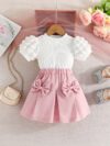 Adorable Pastel Dream Girls Summer Set featuring a pastel colored top and bottom perfect for summer The outfit is shown on a young girl highlighting its comfortable and stylish design