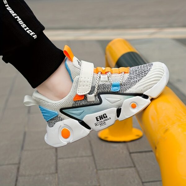 Stylish and breathable Color Block Boys Running Shoes from Newness, perfect for active kids. The shoes feature a vibrant color block design.