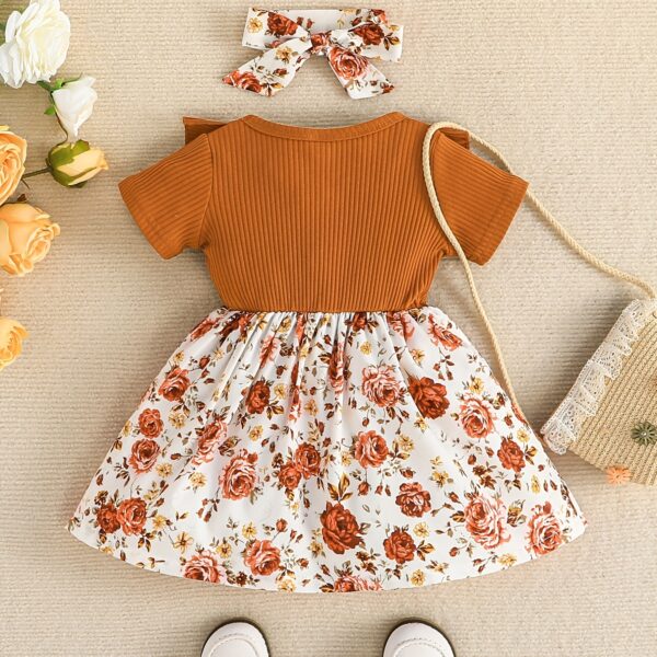 Adorable baby girl wearing a Summer Bloom floral dress, perfect for summer.