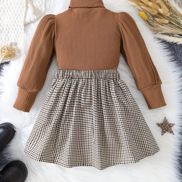 Adorable Newness toddler girl set featuring a cozy knit top and a chic houndstooth skirt, perfect for fall and winter.