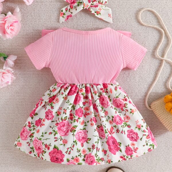 Adorable baby girl wearing a Summer Bloom floral dress, perfect for summer.