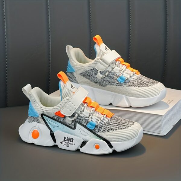 Stylish and breathable Color Block Boys Running Shoes from Newness, perfect for active kids. The shoes feature a vibrant color block design.