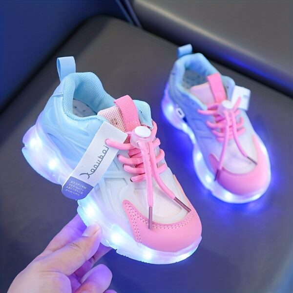 Kids' GUANGLAN Nova Glow Shoes lighting up at night, showcasing their lightweight and durable design. Perfect for nighttime play and adventures!
