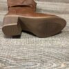 Newness Sunset Rider Ruched Cowboy Boots Brown leather cowboy boots with ruched detailing shown from the side in a lifestyle shot