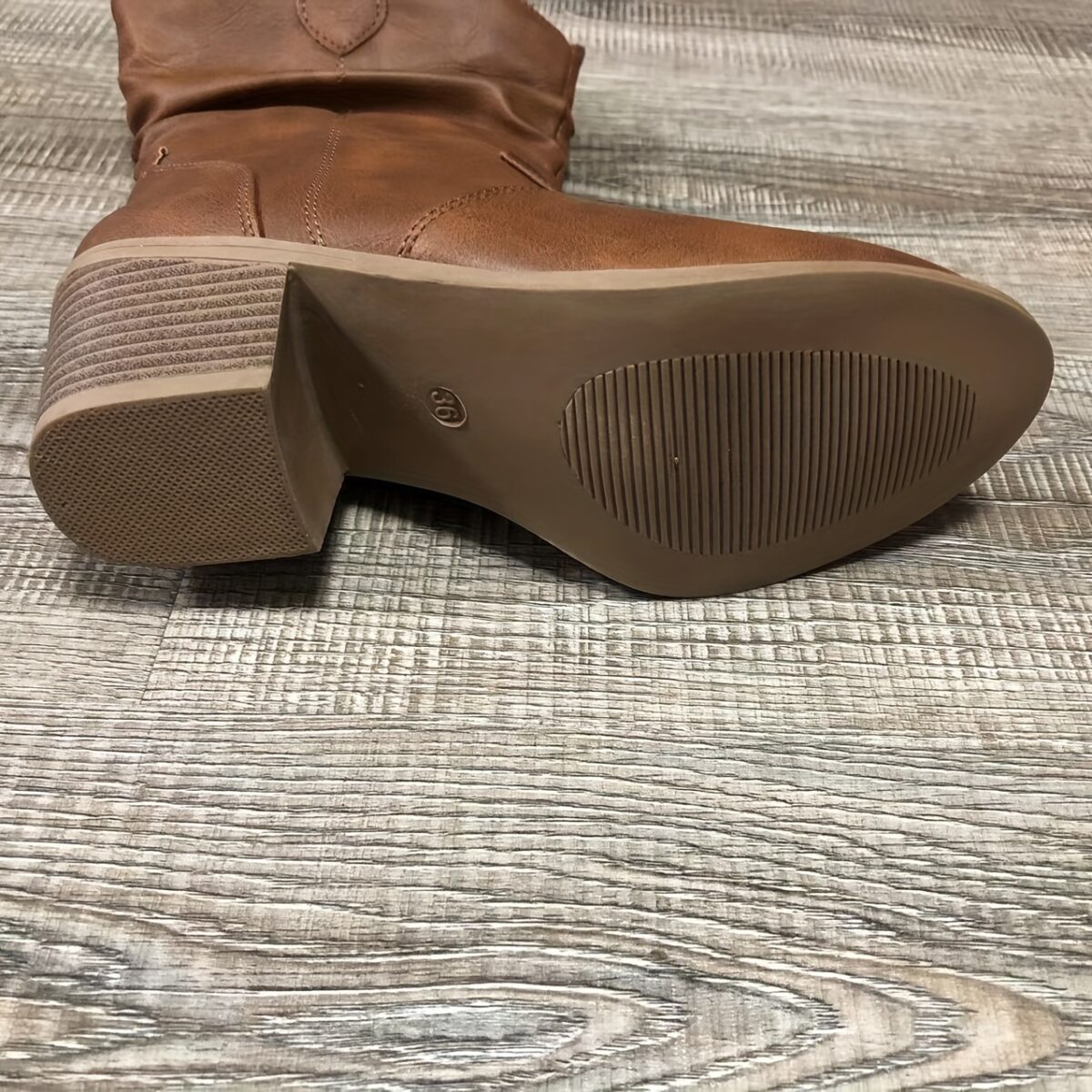 Newness Sunset Rider Ruched Cowboy Boots Brown leather cowboy boots with ruched detailing shown from the side in a lifestyle shot