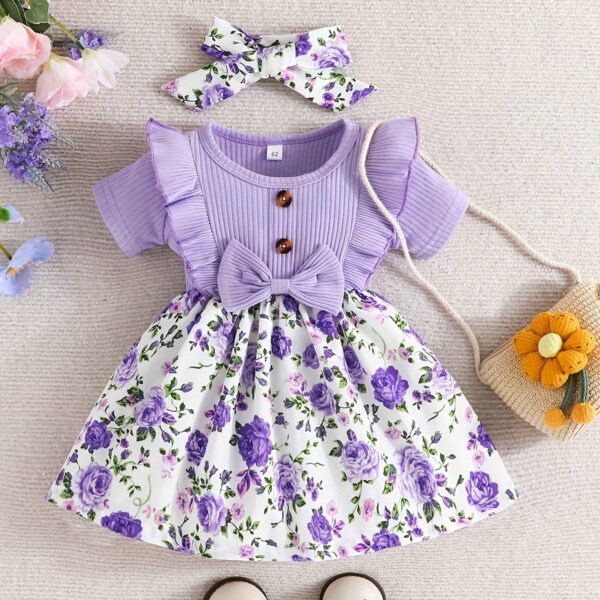 Adorable baby girl wearing a Summer Bloom floral dress, perfect for summer.