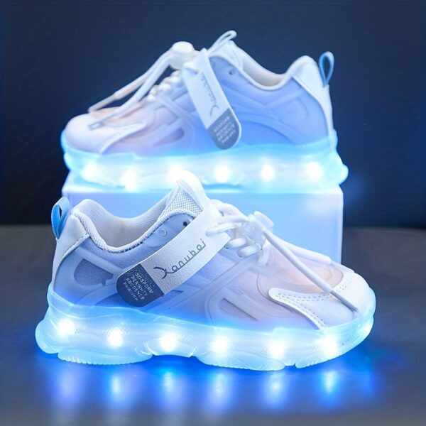 Kids' GUANGLAN Nova Glow Shoes lighting up at night, showcasing their lightweight and durable design. Perfect for nighttime play and adventures!