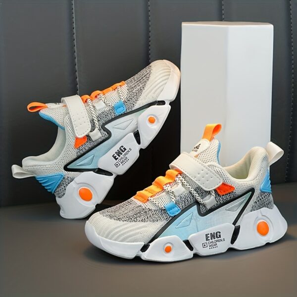 Stylish and breathable Color Block Boys Running Shoes from Newness, perfect for active kids. The shoes feature a vibrant color block design.