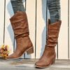 Newness Sunset Rider Ruched Cowboy Boots Brown leather cowboy boots with ruched detailing shown from the side in a lifestyle shot