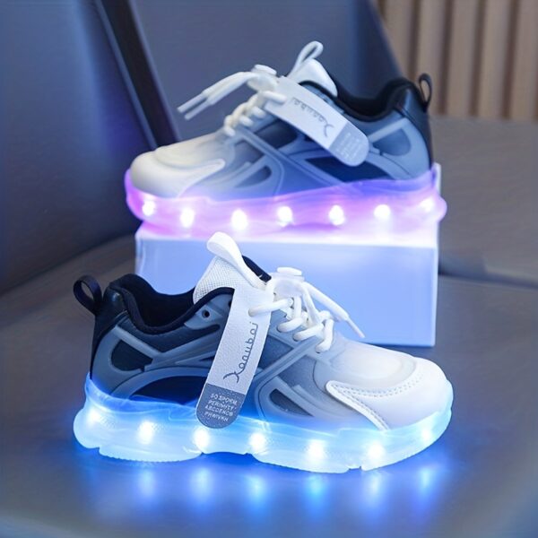 Kids' GUANGLAN Nova Glow Shoes lighting up at night, showcasing their lightweight and durable design. Perfect for nighttime play and adventures!