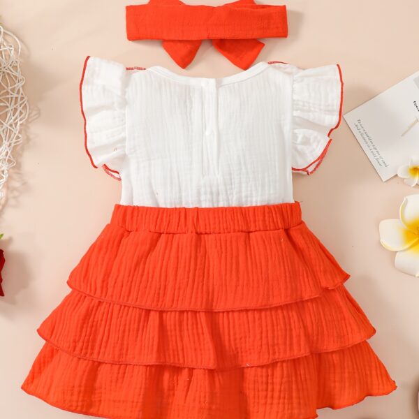 Adorable toddler girl in a vibrant Summer Bloom dress, perfect for summer adventures. The dress features a playful floral print and comfortable, breathable fabric.
