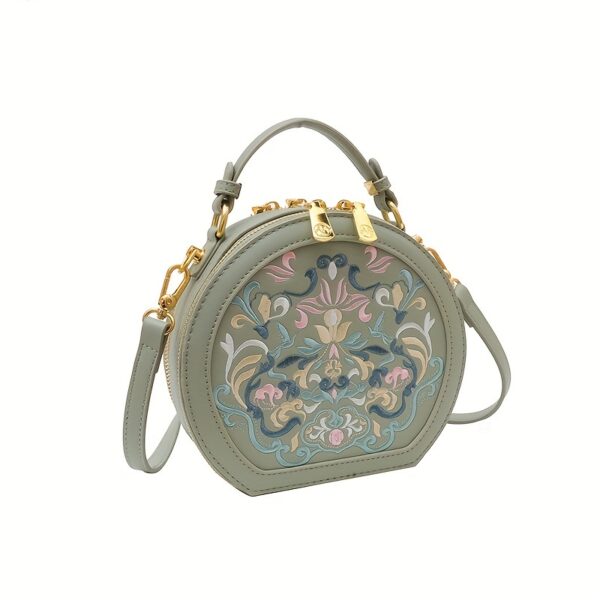 Vienna Embroidered Crossbody Bag in chic faux leather with golden hardware and unique embroidered design.