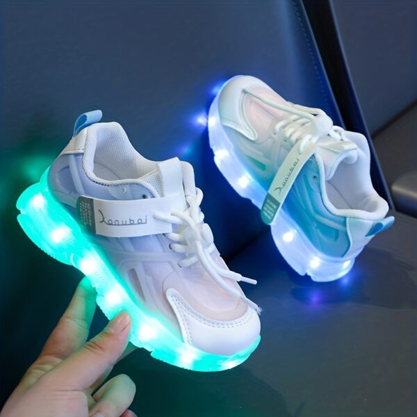 Kids' GUANGLAN Nova Glow Shoes lighting up at night, showcasing their lightweight and durable design. Perfect for nighttime play and adventures!
