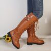 Newness Rebellious Spirit Buckle Knee Boots Elevate your style with these edgy knee high boots featuring a striking buckle detail Perfect for adding a touch of rebellion to any outfit