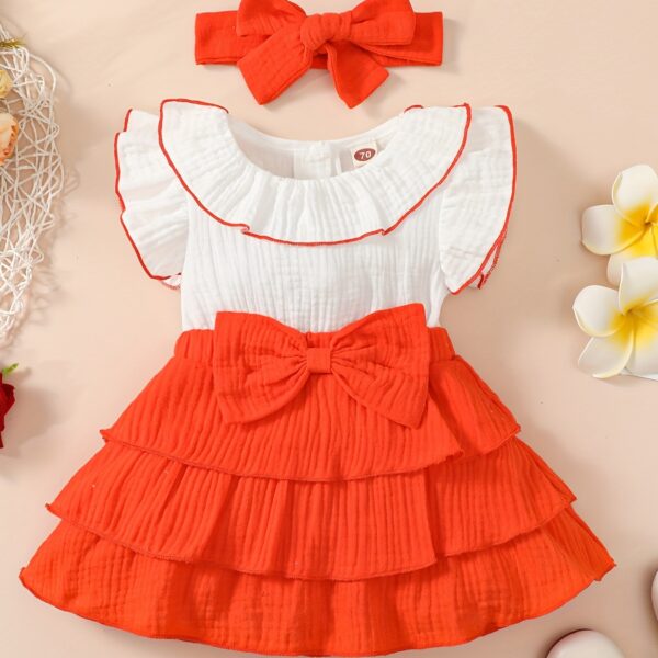 Adorable toddler girl in a vibrant Summer Bloom dress, perfect for summer adventures. The dress features a playful floral print and comfortable, breathable fabric.