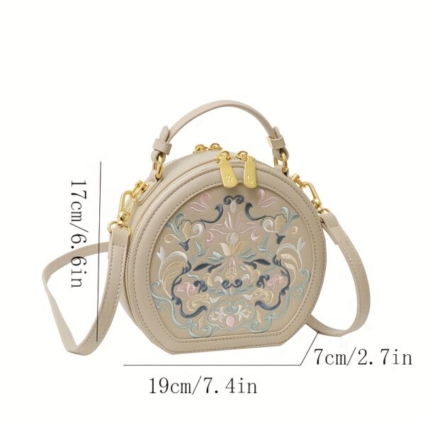 Vienna Embroidered Crossbody Bag in chic faux leather with golden hardware and unique embroidered design.