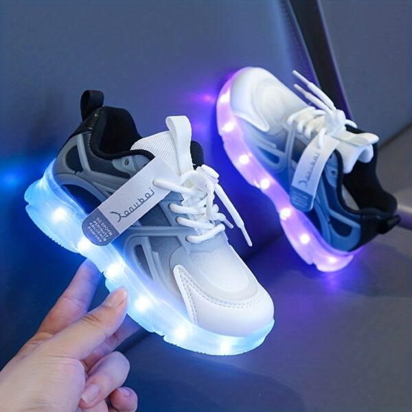 Kids' GUANGLAN Nova Glow Shoes lighting up at night, showcasing their lightweight and durable design. Perfect for nighttime play and adventures!