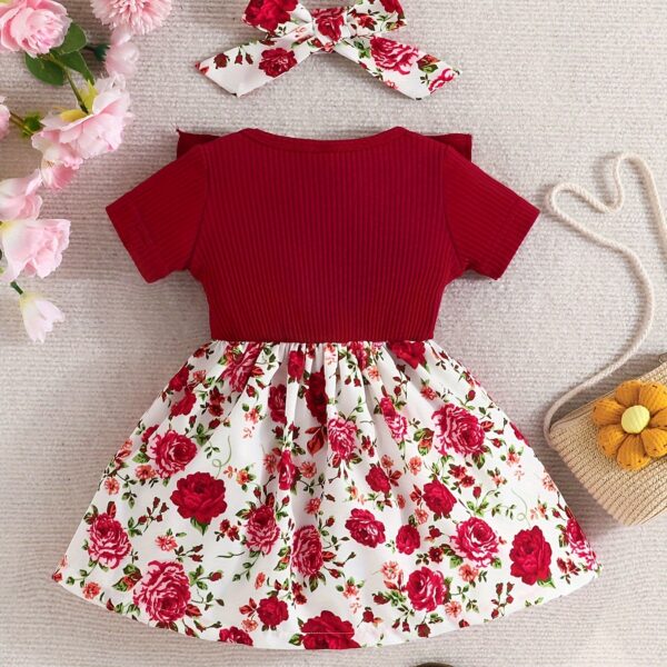Adorable baby girl wearing a Summer Bloom floral dress, perfect for summer.