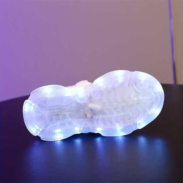 Kids' GUANGLAN Nova Glow Shoes lighting up at night, showcasing their lightweight and durable design. Perfect for nighttime play and adventures!