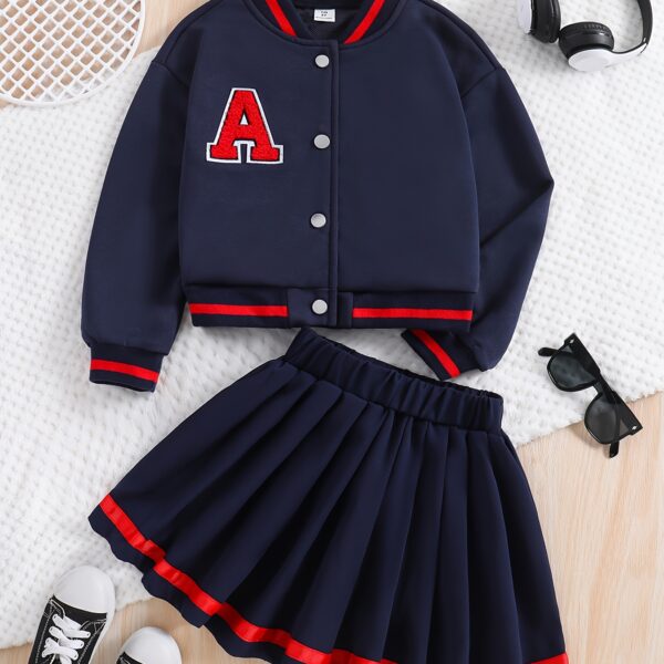 Stylish preppy varsity jacket and skirt set in navy and cream, modeled on a student in a school setting