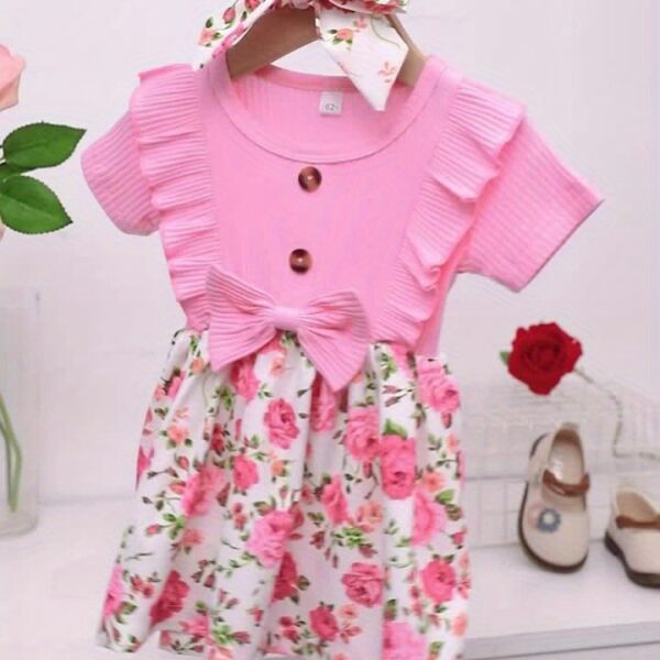 Adorable baby girl wearing a Summer Bloom floral dress, perfect for summer.