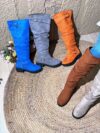 Newness Slouchy Knee High Boots in brown leather showcasing a chic and casual style perfect for winter The boots are slouchy and knee high highlighting their comfortable and fashionable design