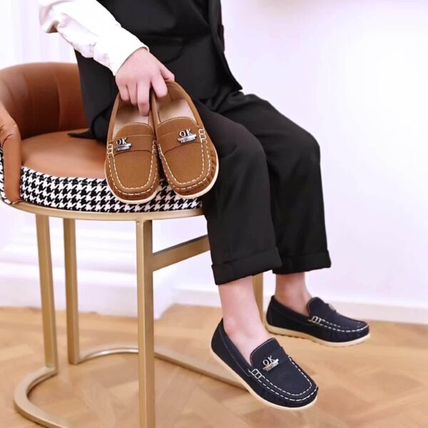 Stylish and comfortable Newness Classic Boys' Loafers, perfect for any occasion. A close-up shot showcasing the loafers' design and quality.