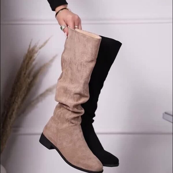 Newness Slouchy Suede Mid-Calf Boots in rich brown suede leather, showcasing the comfortable slouchy fit and mid-calf height. Perfect for adding a touch of effortless chic to any winter outfit.