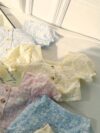 Adorable baby girl wearing a Summer Bloom floral outfit perfect for summer The outfit features a delightful floral pattern