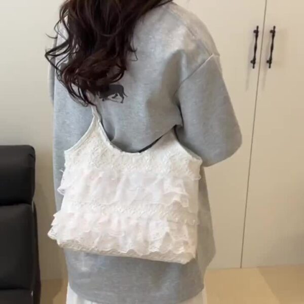 Newness Casablanca Lace Tote Bag: A stunning white lace tote bag, perfect for everyday use or travel. Showcases intricate lace detailing and roomy interior.