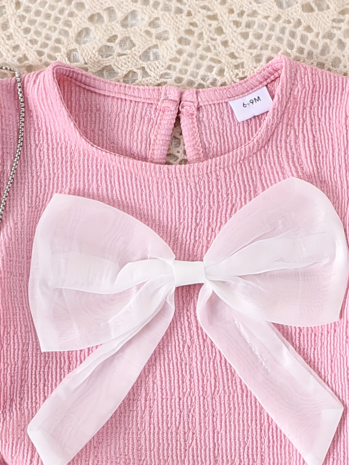 Adorable toddler girl in a stylish summer outfit featuring a cute bow Shop Newness for more childrens fashion