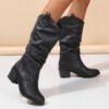 Newness Sunset Rider Ruched Cowboy Boots Brown leather cowboy boots with ruched detailing shown from the side in a lifestyle shot