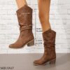 Newness Sunset Rider Ruched Cowboy Boots Brown leather cowboy boots with ruched detailing shown from the side in a lifestyle shot