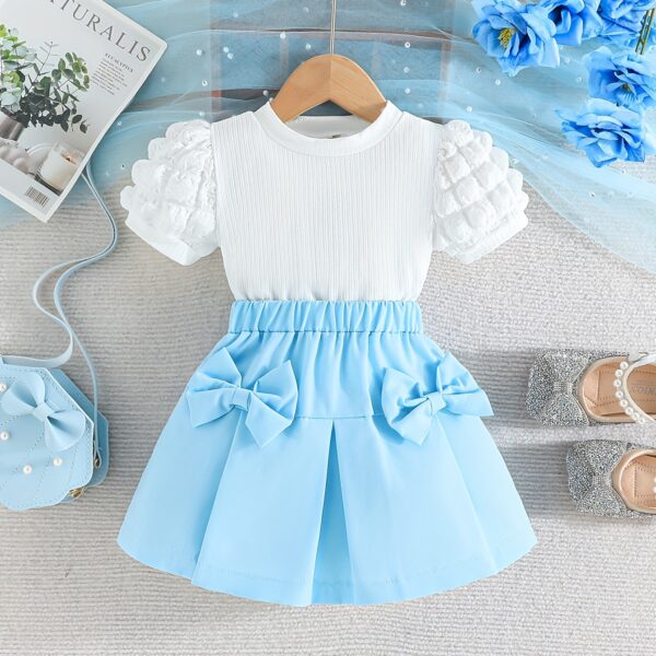 Adorable Pastel Dream Girls Summer Set featuring a pastel colored top and bottom perfect for summer The outfit is shown on a young girl highlighting its comfortable and stylish design