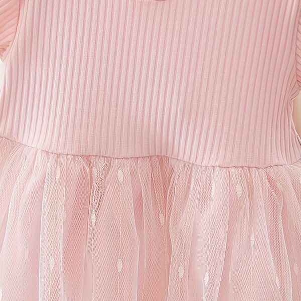 Adorable little girl twirling in a pink Summer Bloom Rose Princess Dress from Newness, showcasing its comfortable and stylish design.