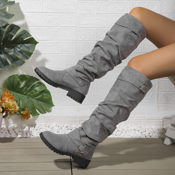 Newness Slouchy Knee-High Boots in brown leather, showcasing a chic and casual style perfect for winter. The boots are slouchy and knee-high, highlighting their comfortable and fashionable design.