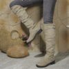Newness Slouchy Knee High Boots in brown leather showcasing a chic and casual style perfect for winter The boots are slouchy and knee high highlighting their comfortable and fashionable design