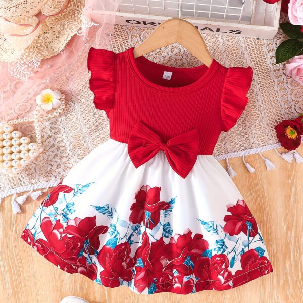 A little girl wearing a charming summer floral print dress.