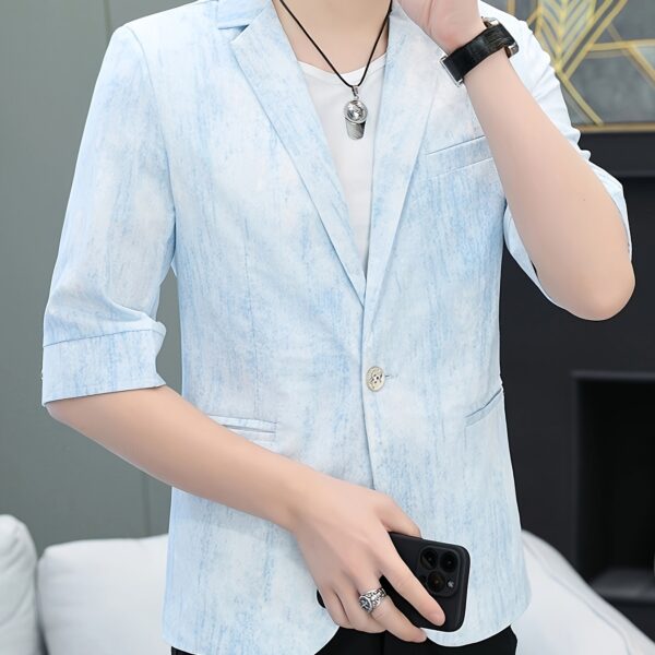 The Newness Dubai Breeze Men's Summer Blazer in a stylish pose on a model.