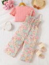 Adorable child wearing Newnesss Summer Bloom Floral Jumpsuit a boho chic floral jumpsuit perfect for sunny days