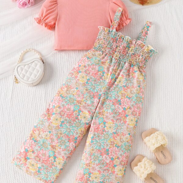 Adorable child wearing Newness's Summer Bloom Floral Jumpsuit, a boho-chic floral jumpsuit perfect for sunny days.