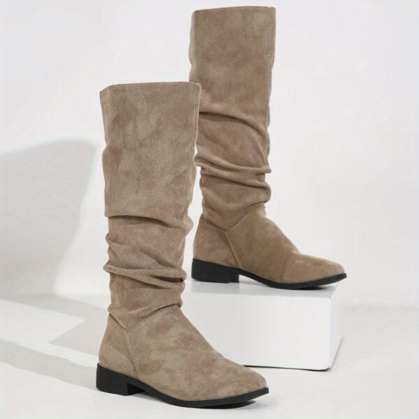 Newness Slouchy Suede Mid-Calf Boots in rich brown suede leather, showcasing the comfortable slouchy fit and mid-calf height. Perfect for adding a touch of effortless chic to any winter outfit.