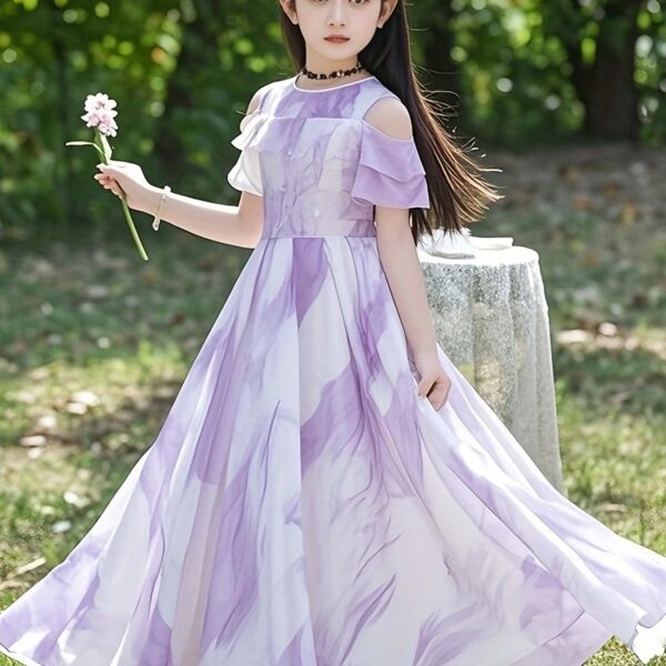 Adorable girl twirling in a flowy, elegant chiffon dress, perfect for summer. The dress is in a beautiful summer garden setting.