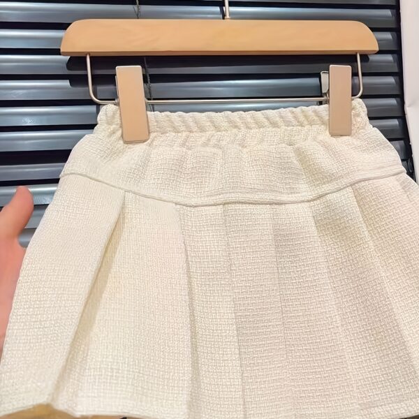 Adorable girls' skirt set in a chic, high-end design, perfect for any occasion.