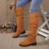 Newness Slouchy Knee High Boots in brown leather showcasing a chic and casual style perfect for winter The boots are slouchy and knee high highlighting their comfortable and fashionable design