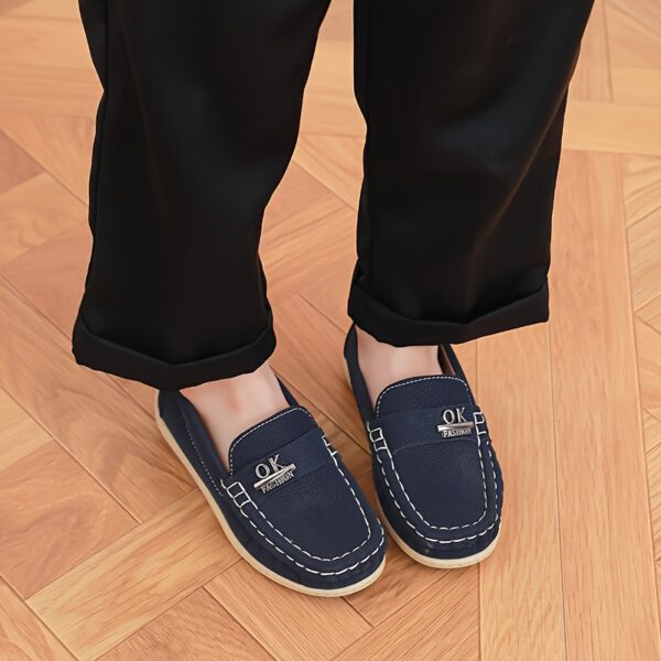 Stylish and comfortable Newness Classic Boys' Loafers, perfect for any occasion. A close-up shot showcasing the loafers' design and quality.