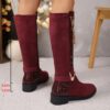 Newness Crimson V Chain Burgundy Knee Boots Elevate your style with these luxurious burgundy knee high boots featuring a striking V chain detail